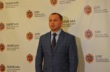 Роман Филипів на фоні press wall